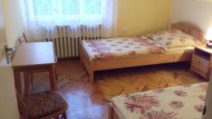 Postel nebo postele na pokoji v ubytování Tiszafa Apartman