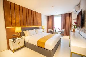 Postel nebo postele na pokoji v ubytování Solano Hotel