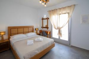 A bed or beds in a room at Petra Aqua Villa