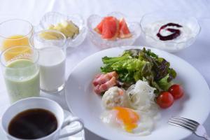 
a white plate topped with different types of food at Muroran Prince Hotel in Muroran
