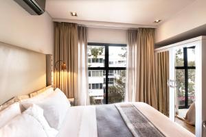 Кровать или кровати в номере Collection Luxury Apartments - Concord 11