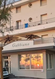 a building with a sign for a casino at Hotel Gabbiano in Rimini