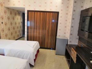 Postel nebo postele na pokoji v ubytování BURJ NAHAR HOTEL L.L.C