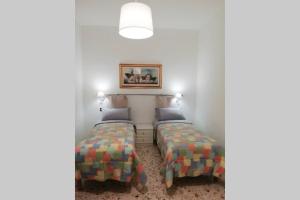 A bed or beds in a room at Mary's House
