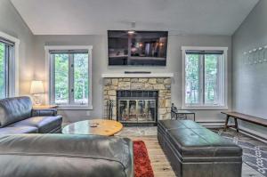 a living room with a couch and a fireplace at Quiet Getaway with Deck Less Than 1 Mi to Jack Frost Resort! in Lake Harmony