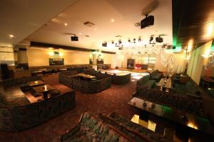 a large room with couches and tables in a restaurant at Hotel Towadaso in Towada