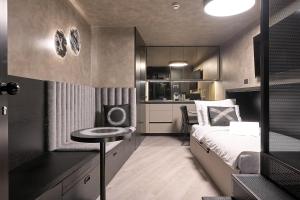 a small bedroom with a bed and a small table at Court 5 in Zagreb