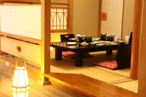 a table with food on it in a room at Hotel Towadaso in Towada