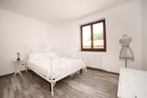 Postel nebo postele na pokoji v ubytování LA CORTE SUL LAGO