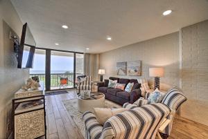 a living room with a couch and a tv at Waterfront Port Aransas Condo with Beach Access! in Port Aransas