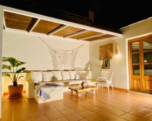 a living room with a couch and a table at Ca'n Perlita in Palma de Mallorca