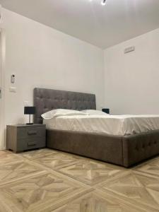 En eller flere senge i et værelse på Residence Comfort Piazza Unità