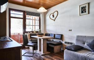 a living room with a table and a couch at Ferienwohnung Bergerlebnis Ötscher in Lackenhof