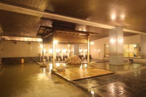 a large room with a stage in a building at Hotel Towadaso in Towada