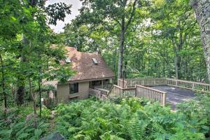 a house with a deck in the woods at Wintergreen Resort Home with 2 Decks and Ski Access! in Roseland