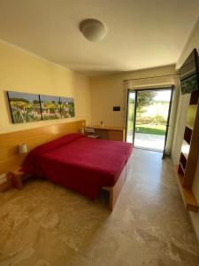 Postel nebo postele na pokoji v ubytování Hotel Poggio Bertino