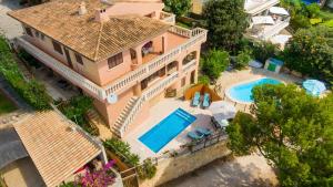 an overhead view of a house with a swimming pool at Sa caleta des moixos in Alcudia