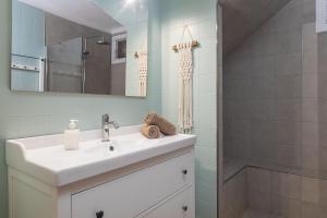 a bathroom with a sink and a shower at Sa caleta des moixos in Alcudia +41 photos