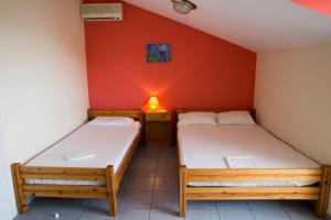 Ένα ή περισσότερα κρεβάτια σε δωμάτιο στο Haus Olymp