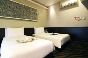 Letto o letti in una camera di Hotel 6 - Ximen