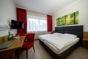 Ένα ή περισσότερα κρεβάτια σε δωμάτιο στο Klaus im Weinviertel