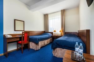 Posteľ alebo postele v izbe v ubytovaní Hotel Olivia + 31 fotografií