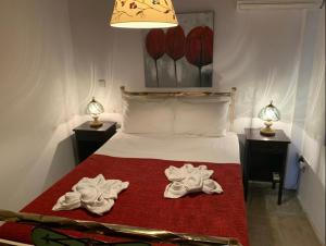 a bedroom with a bed with two towels on it at ANOI 1-bedroom country House in Episkopi Pafou