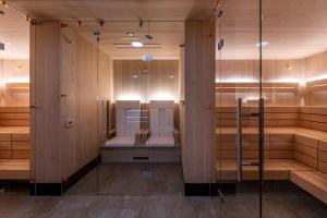 Rúm í herbergi á Sunstar Hotel Lenzerheide
