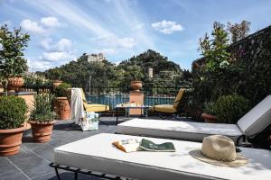 a balcony with a view of a mountain at Splendido Mare, A Belmond Hotel, Portofino in Portofino