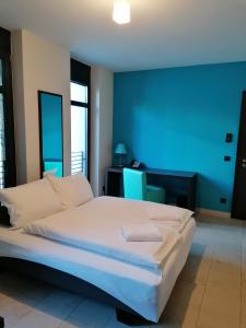 
Ein Bett oder Betten in einem Zimmer der Unterkunft KH Hotel mit Restaurant
