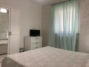 Una cama o camas en una habitación de Hotel Nido delle Rondini