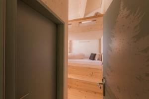 Letto o letti in una camera di Stoos Hüttä