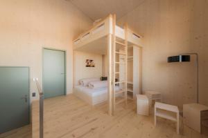 Letto o letti in una camera di Stoos Hüttä