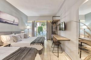 Katil atau katil-katil dalam bilik di Contessa Hotel