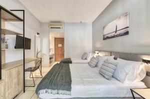 Katil atau katil-katil dalam bilik di Contessa Hotel