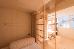 Letto o letti in una camera di Stoos Hüttä