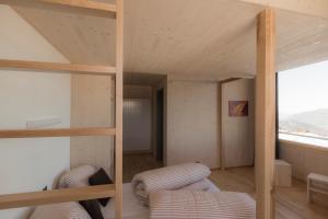 Letto o letti in una camera di Stoos Hüttä