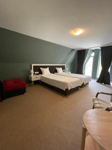 Ένα ή περισσότερα κρεβάτια σε δωμάτιο στο Family Hotel Gradina