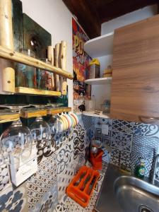 a kitchen with a sink and a counter top at Mancora Apartments in Máncora