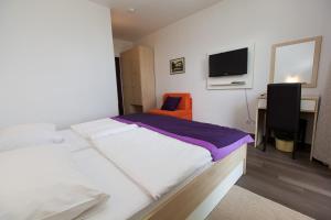 Postel nebo postele na pokoji v ubytování Hotel Slaven