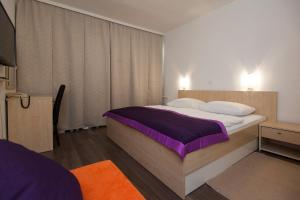 Postel nebo postele na pokoji v ubytování Hotel Slaven