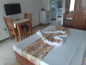 TV a/nebo společenská místnost v ubytování La Residence D'Almee Guesthouse
