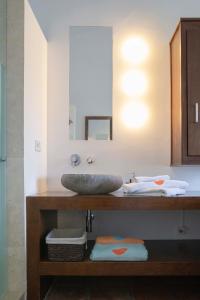 a bathroom with a sink and a mirror at Arriadh Hotel in Ronda