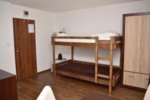 Postel nebo postele na pokoji v ubytování Pension U Krbu