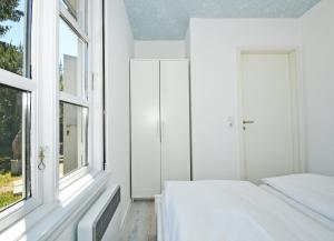 Postel nebo postele na pokoji v ubytování Ferienanlage Bansin Seepferdchen 9