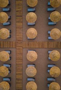 an overhead view of umbrellas on a street with chairs at Liu Resorts in Side