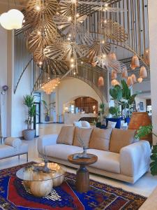 a large living room with couches and a large ceiling at Liu Resorts in Side