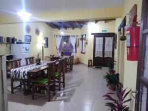 a dining room with a table and some chairs at La Casa de la Abuela Tilcara in Tilcara