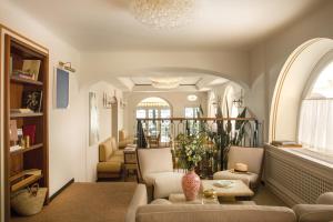 a living room with a couch and a table at Splendido Mare, A Belmond Hotel, Portofino in Portofino