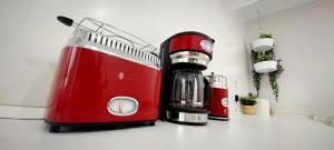 a red blender sitting on top of a counter at Hispania House in Huelva